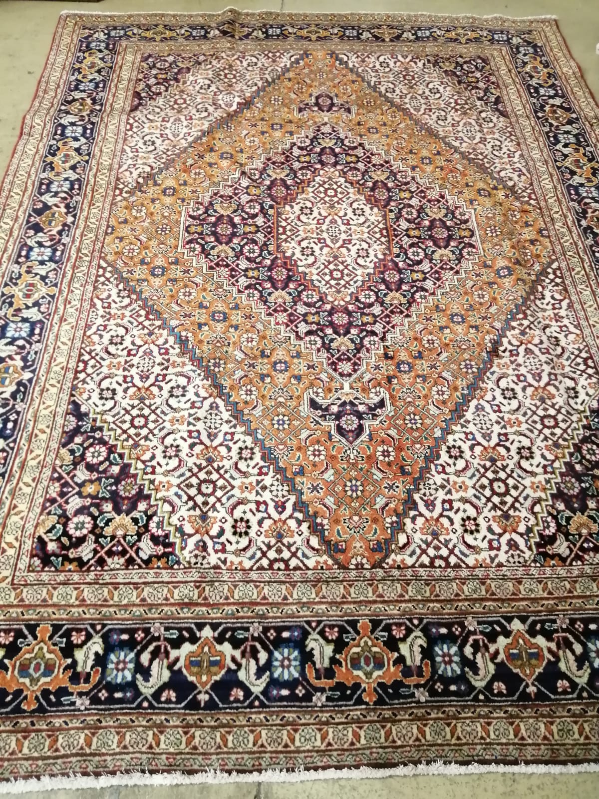 A Tabriz blue ground carpet, 285 x 205cm